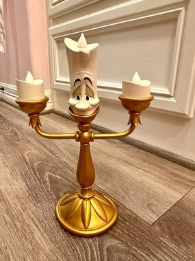 Disney Gold Lumiere Three-Arm Candle Holder that lights up.